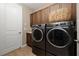 Laundry room with washer, dryer, and additional storage at 5589 Nw 40Th Loop, Ocala, FL 34482