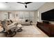 Living room with sectional sofa and hardwood floors at 5589 Nw 40Th Loop, Ocala, FL 34482