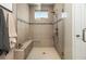 Large walk-in shower with tiled walls and built-in seat at 5589 Nw 40Th Loop, Ocala, FL 34482