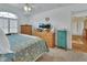 Main bedroom with king-size bed, dresser, and plenty of natural light at 675 Winterberry Trl, Deland, FL 32724