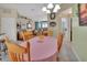 Bright dining room features a round table with seating for four, overlooking the living area at 675 Winterberry Trl, Deland, FL 32724