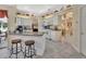 Spacious kitchen island with white cabinetry and breakfast bar at 675 Winterberry Trl, Deland, FL 32724