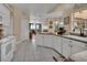 Spacious kitchen with white cabinets, granite countertops, and stainless steel appliances at 675 Winterberry Trl, Deland, FL 32724