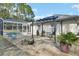 Relaxing patio with fire pit, pergola, and ample seating at 675 Winterberry Trl, Deland, FL 32724