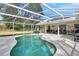 Screened pool with patio, backyard, and solar panels at 675 Winterberry Trl, Deland, FL 32724