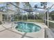 Screened pool and patio area with backyard view at 675 Winterberry Trl, Deland, FL 32724