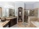 Elegant bathroom with double sinks, a soaking tub, and a shower at 676 Newhall Ln, Debary, FL 32713