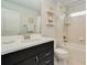 Clean bathroom with a single vanity and tub shower combo at 6832 Forkmead Ln, Port Orange, FL 32128