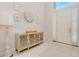 Bright entryway with white walls, tiled floors, and a stylish console table at 6832 Forkmead Ln, Port Orange, FL 32128