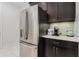 Stainless steel refrigerator and coffee bar in modern kitchen at 6832 Forkmead Ln, Port Orange, FL 32128