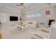 Bright playroom featuring a comfy white couch and plenty of toys at 6832 Forkmead Ln, Port Orange, FL 32128