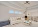Spacious playroom with white couch, toy storage, and natural light at 6832 Forkmead Ln, Port Orange, FL 32128