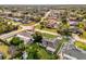 An aerial view showing houses, roads, trees, and swimming pools in the neighborhood at 728 Vicksburg St, Deltona, FL 32725