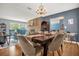 Open-concept dining room with hardwood floors and ample natural light at 728 Vicksburg St, Deltona, FL 32725