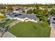 Aerial view of a charming single-story home with a lush lawn and a neatly maintained landscape at 728 Vicksburg St, Deltona, FL 32725