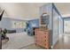 Spacious living room with blue walls, carpet flooring, and a decorative dresser at 728 Vicksburg St, Deltona, FL 32725