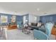 Bright living room with a comfortable sofa, two chairs, and a dining area, perfect for relaxing and entertaining at 728 Vicksburg St, Deltona, FL 32725