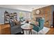 Bright living room with a decorative brick fireplace, comfortable seating and natural lighting at 728 Vicksburg St, Deltona, FL 32725