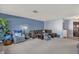 Cozy living room with plush carpeting and a comfortable sectional sofa at 728 Vicksburg St, Deltona, FL 32725