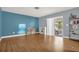Versatile room with wood-look flooring, sliding glass doors, and ample natural light at 728 Vicksburg St, Deltona, FL 32725