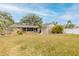 Spacious backyard showcasing a home's exterior and landscaping at 772 N Beach St, Ormond Beach, FL 32174