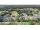 Aerial view of a residential neighborhood with houses and lush green trees at 805 Gordonia Ct, Deland, FL 32724