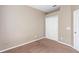 Simple bedroom with neutral walls and carpet at 805 Gordonia Ct, Deland, FL 32724