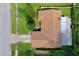 An aerial view of a home with a brown shingle roof, surrounded by lush, green landscaping at 949 Tall Pine Dr, Port Orange, FL 32127
