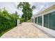 Landscaped backyard features a water fountain with a screened-in porch at 949 Tall Pine Dr, Port Orange, FL 32127
