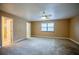 Spacious bedroom with neutral walls, carpet floors, large window, ceiling fan, and natural light at 949 Tall Pine Dr, Port Orange, FL 32127