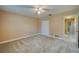 Bedroom with neutral walls, carpet floors, ceiling fan, closet and natural light at 949 Tall Pine Dr, Port Orange, FL 32127
