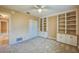This room boasts built-in shelves with cabinets, carpet flooring, and a large closet at 949 Tall Pine Dr, Port Orange, FL 32127