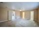 Spacious bedroom with neutral walls, carpet floors, and ample natural light, leading to an en-suite bathroom at 949 Tall Pine Dr, Port Orange, FL 32127
