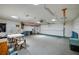 Spacious garage with neutral carpet and lots of lighting, ready for all your storage needs at 949 Tall Pine Dr, Port Orange, FL 32127