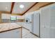 Bright kitchen features white cabinets, wooden countertops, stylish backsplash and stainless steel appliances at 949 Tall Pine Dr, Port Orange, FL 32127