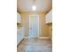 Pantry features tile flooring, built-in cabinets, and a white door at 949 Tall Pine Dr, Port Orange, FL 32127