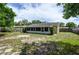 Large backyard with a screened patio and space for outdoor activities at 1016 Martex Dr, Apopka, FL 32703