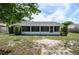 Large backyard with a screened patio and space for outdoor activities at 1016 Martex Dr, Apopka, FL 32703