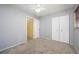 Simple bedroom with carpeting, double door closet, and ceiling fan at 1016 Martex Dr, Apopka, FL 32703