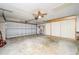 Two-car garage with built-in cabinets and extra storage at 1016 Martex Dr, Apopka, FL 32703