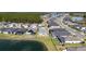 Aerial view showing a community with lakes, manicured lawns and well-maintained homes at 105 Cerise Ct, Daytona Beach, FL 32124