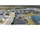 Real estate aerial showing a community with lakes and trees at 105 Cerise Ct, Daytona Beach, FL 32124