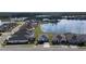 Aerial view of a single-Gathering home on a well-maintained street with lake views at 105 Cerise Ct, Daytona Beach, FL 32124