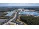 A neighborhood aerial view of a community with lakes, a clubhouse and pool at 105 Cerise Ct, Daytona Beach, FL 32124
