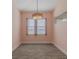 Bright dining area featuring natural light, neutral walls, and modern lighting fixture for intimate meals at 105 Cerise Ct, Daytona Beach, FL 32124