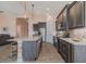 Open-concept kitchen boasting a large island, stainless steel appliances, and stylish pendant lighting fixtures at 105 Cerise Ct, Daytona Beach, FL 32124