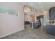 Open-concept kitchen and dining area with granite island, stainless steel appliances, and comfortable seating at 105 Cerise Ct, Daytona Beach, FL 32124