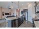 Spacious kitchen with granite island, stainless steel appliances, and an open view into the living area at 105 Cerise Ct, Daytona Beach, FL 32124