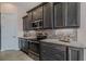 Gourmet kitchen featuring stainless steel appliances, granite countertops, and mosaic tile backsplash at 105 Cerise Ct, Daytona Beach, FL 32124