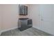 Laundry room with washer and dryer, overhead cabinet, and white door at 105 Cerise Ct, Daytona Beach, FL 32124